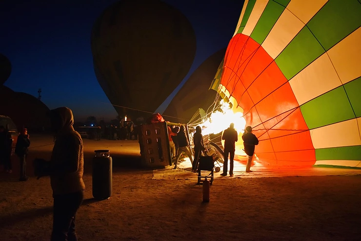 Luxor to Aswan Itinerary - Hot air balloon being inflated for ride over Valley of the Kings