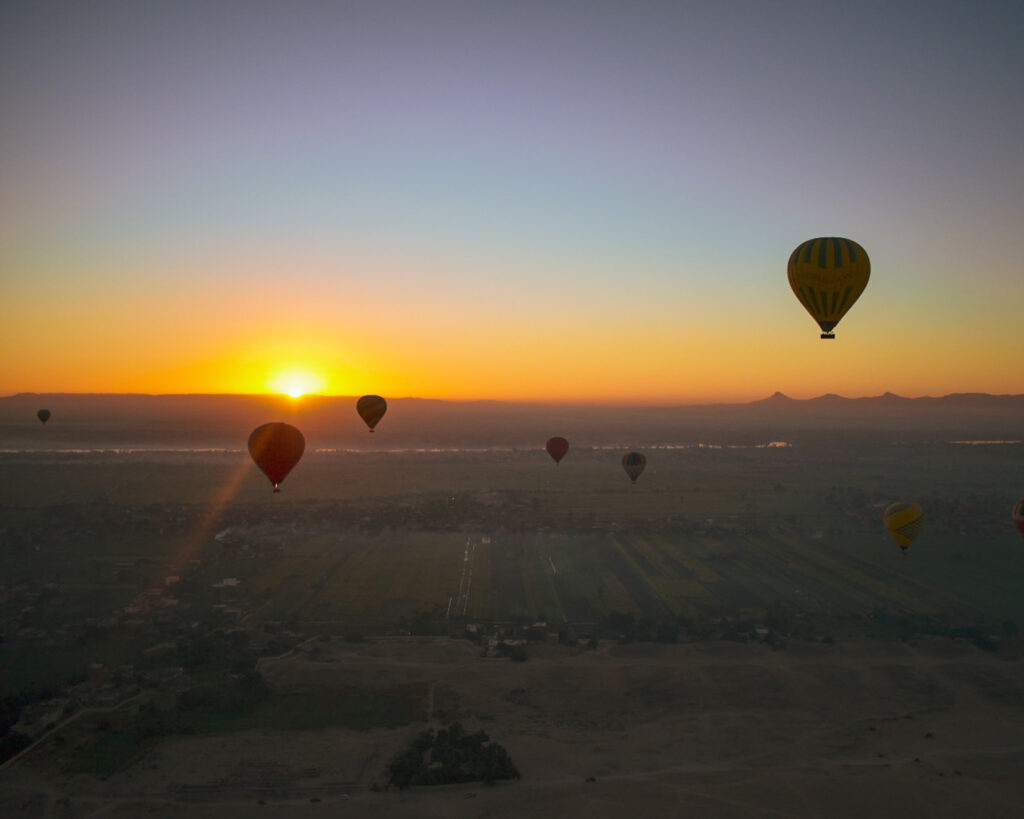 Hot air balloons at sunrise  in Luxor