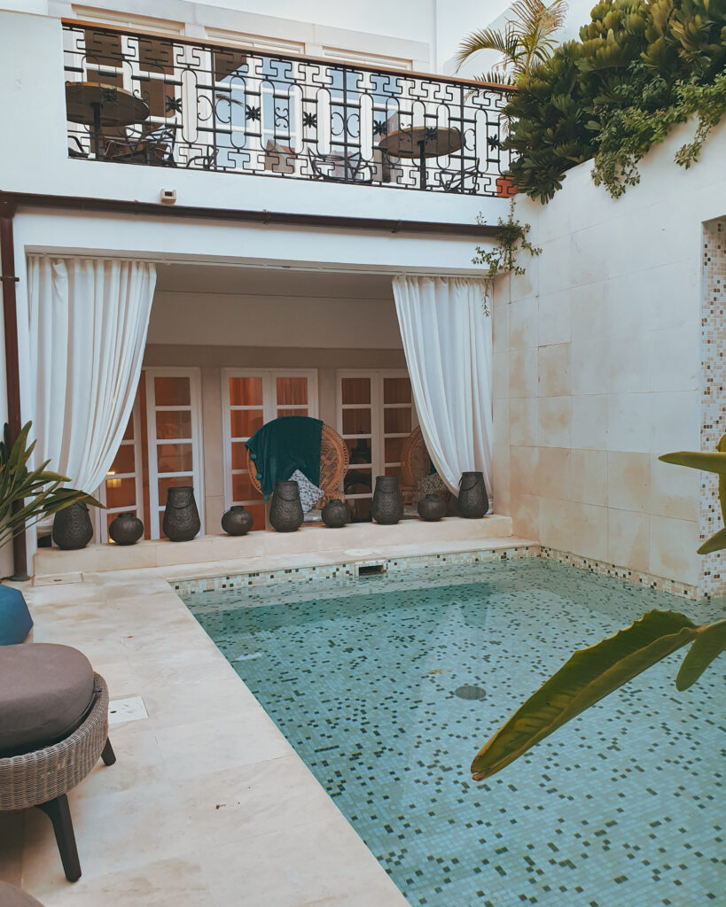 Pool and partially covered garden area at Villa Zawaia