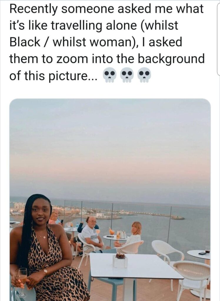 black woman travelling solo being stared at by a white couple.